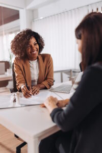 Female financial consultant manager talking with a client at the bank